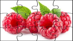 A jigsaw puzzle of raspberries